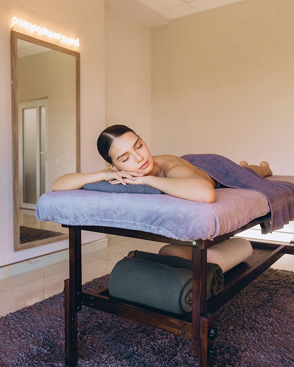 Woman relaxing during massage at spa in Business Bay Dubai